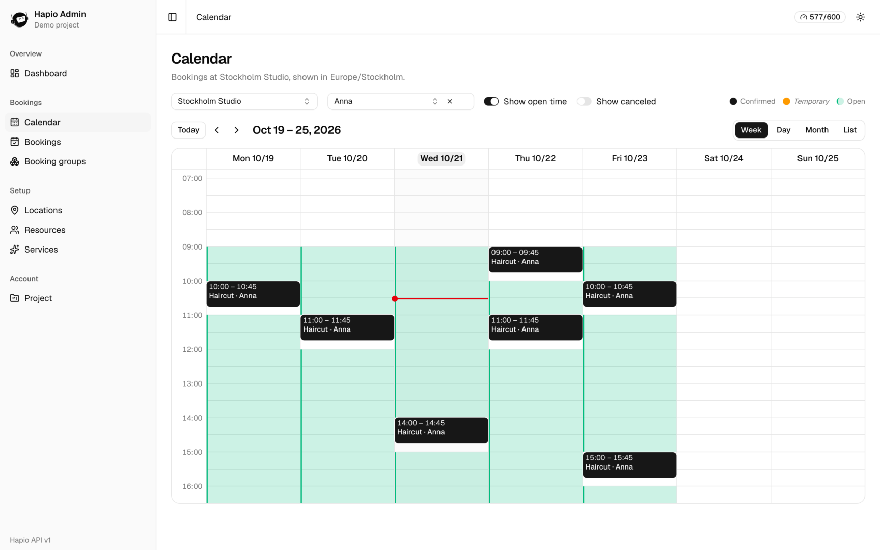The calendar week view with a resource's open time shown behind the bookings
